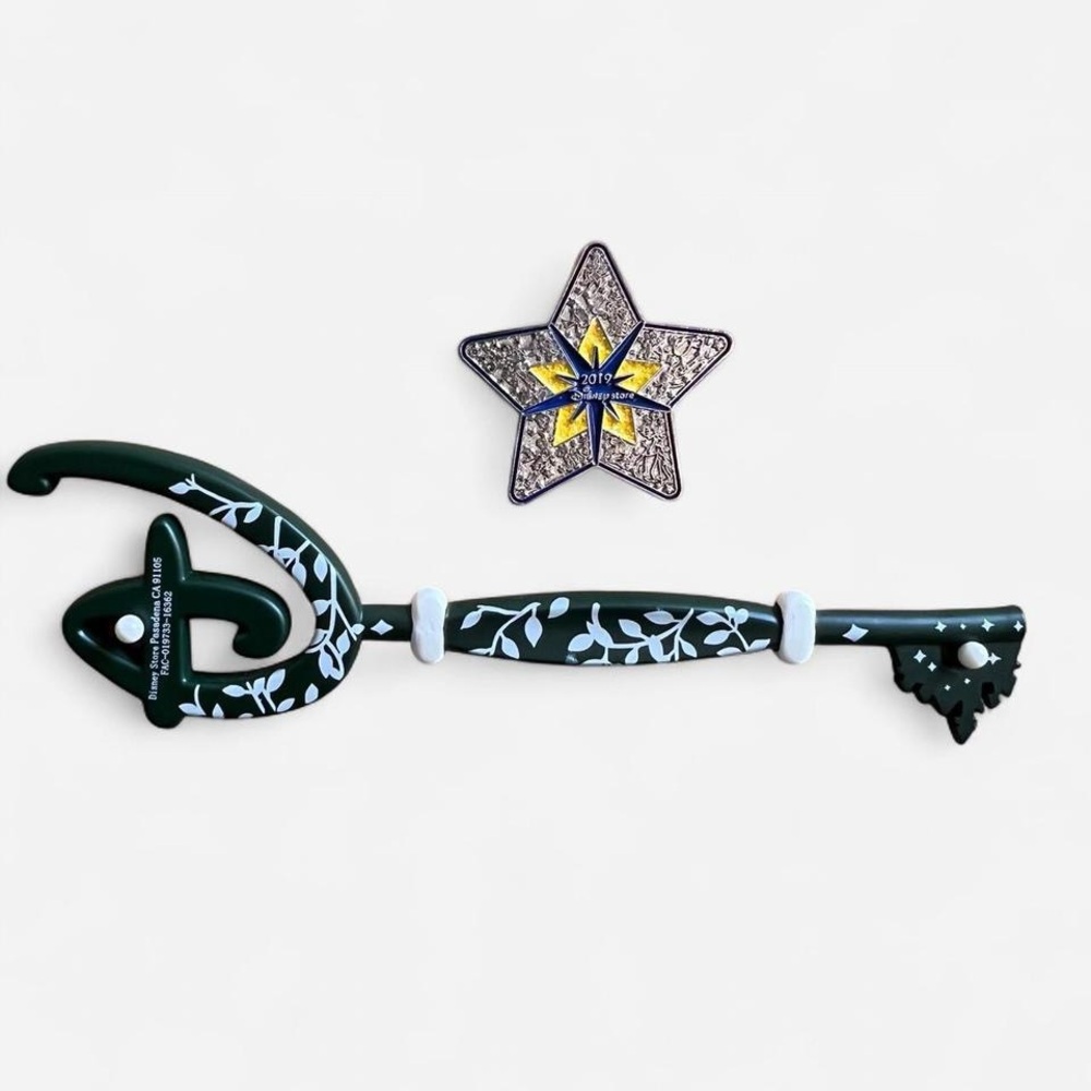 Disney store opening key and Disney store holiday pin